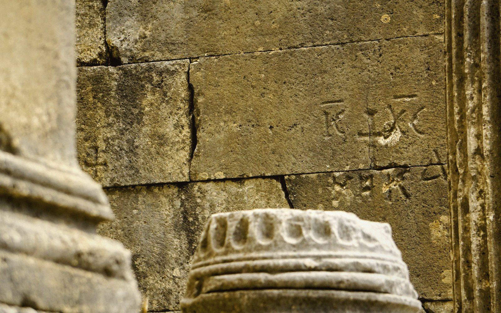 A carved inscription raked by low light